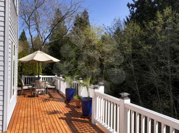Home outdoor deck freshly painted during lovely spring day 