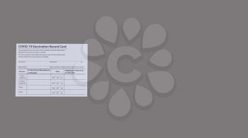 Covid 19 vaccination record card in both English and Spanish languages on a solid gray background with copy space. Individual record for use during the covid 19 coronavirus world pandemic 