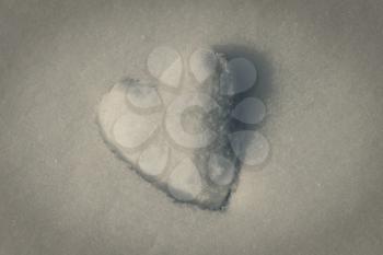 Retro toned snow heart