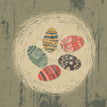 Easter eggs in nest on wooden texture. Easter background, retro styled.