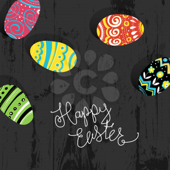 Easter eggs on wooden background.  Happy Easter greetings card