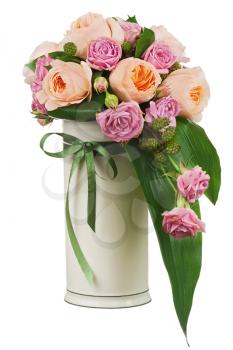 Colorful flower bouquet from roses and peon flowers in vase isolated on white background. Closeup.