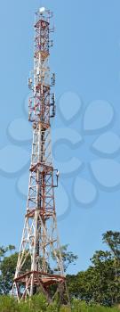 Telecommunication towers with deep blue sky.