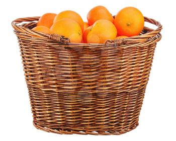Oranges in wicker basket isolated on white background.