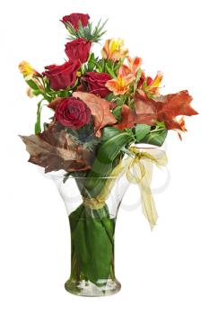 Floral bouquet of roses and lilies arrangement centerpiece in vase isolated on white background. Closeup.