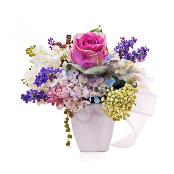 Bouquet from artificial flowers arrangement centerpiece in vase isolated on white background. Closeup.
