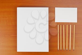 Corporate ID set on wood background for presentations and portfolios.