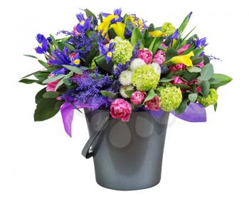 Beautiful bouquet of tulips, iris, alstroemeria, lilies and other flowers in vase isolated on white background. 