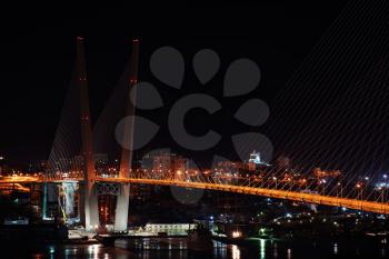 night view of the bridge in the Russian Vladivostok over the Golden Horn bay