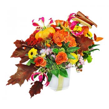 Autumn arrangement of flowers, vegetables and fruits isolated on white background. Closeup.