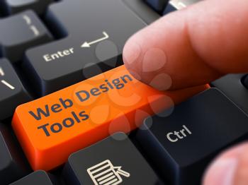 Person Click on Orange Keyboard Button with Text Web Design Tools. Selective Focus. Closeup View. 3D Render.