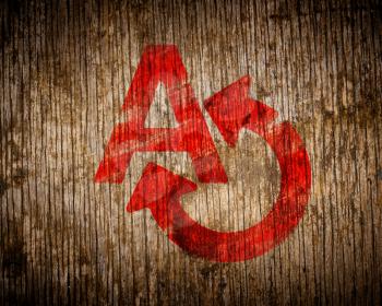 Royalty Free Photo of a Symbol Painted on Wood