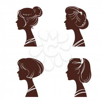 Four silhouettes of women heads with beautiful stylized haircut