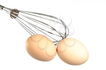 Royalty Free Photo of Eggs and a Whisk