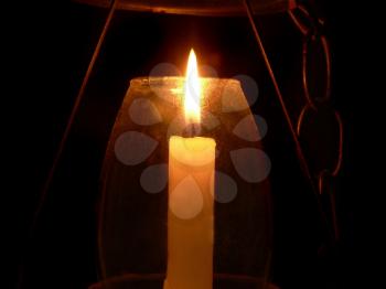 Royalty Free Photo of a Candle Inside a Glass Holder
