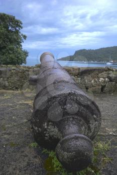 VErtical shot of an old Spanish colonial cannon at Portobelo, Panama