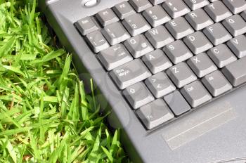 Macro shot of a laptopp over grass 