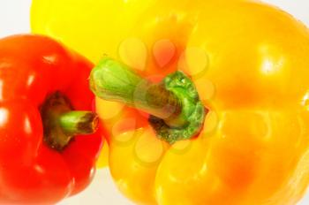 Macro shot of colorful bell peppers isolated on white