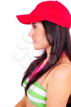 Attractive young woman wearing a red baseball cap