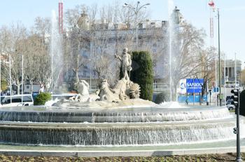MADRID-SPAIN-FEB 19, 2019:The Neptune Fountain is a white marble neo-classical fountain, and one of the most beautiful in Madrid. It sits in the centre of Plaza de Cánovas del Castillo; better known as Plaza de Neptuno.