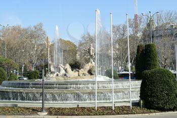 MADRID-SPAIN-FEB 19, 2019:The Neptune Fountain is a white marble neo-classical fountain, and one of the most beautiful in Madrid. It sits in the centre of Plaza de Cánovas del Castillo .