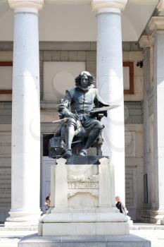 MADRID-SPAIN-FEB 19, 2019: The statue of Diego de Velázquez (1599-1660) located in front of the main facade of the Prado Museum. It was made in 1899 by sculptor Aniceto Marinas from Segovia. 
