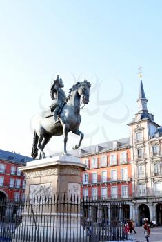 MADRID-SPAIN-FEB 19, 2019: The Felipe III Statue, Madrid stands in the centre of Plaza Mayor depicts King Philip III of Spain triumphantly riding his stallion.