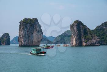 Rocky islands and boats in Halong Bay, Vietnam, Southeast Asia