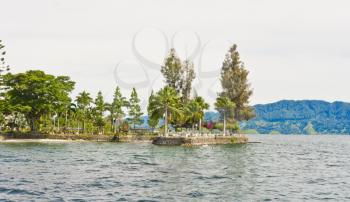 Samosir Island, is a large volcanic island in Lake Toba, Sumatra, Indonesia, Southeast Asia