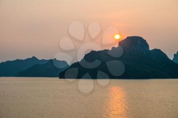 Sunset over mountains and sea, Halong Bay, Vietnam