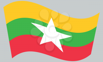 Flag of Myanmar waving on gray background