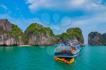 Cruise boat in Halong Bay, Vietnam, Southeast Asia. UNESCO World Heritage Site.