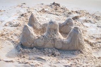 Sand castle on tropical white sandy beach