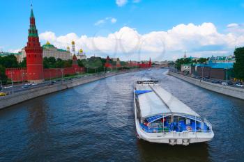 View of Moscow Kremlin and big barge on river, Russia