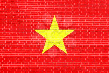 Flag of Vietnam on brick wall texture background. Vietnamese national flag.
