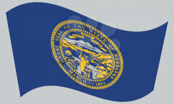 Nebraskan official flag, symbol. American patriotic element. USA banner. United States of America background. Flag of the US state of Nebraska waving on gray background, vector