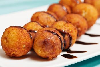 Roasted cheese balls deep fried poured chocolate