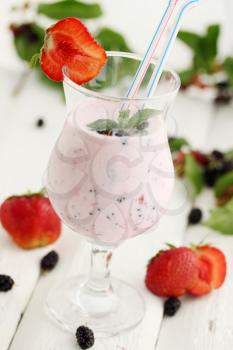 mix of yogurt with strawberries and mulberries
