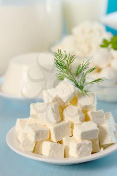 Feta cheese cut into slices on a plate