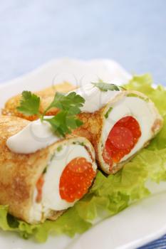 pancake stuffed with egg and red caviar