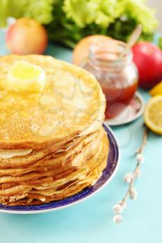 pile of thin pancakes on a plate