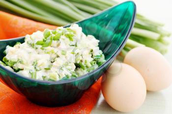 Spring salad with onions and boiled eggs