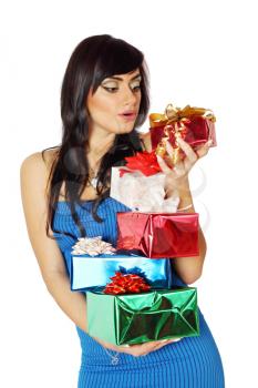 beautiful brunette holding a stack of gifts