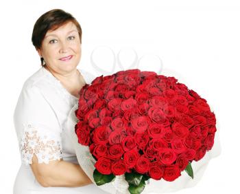 Elderly woman holds a huge bouquet of red roses