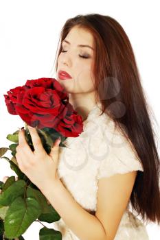 Woman sniffing bouquet of roses covered his eyes