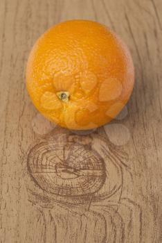 Orange on the wooden table