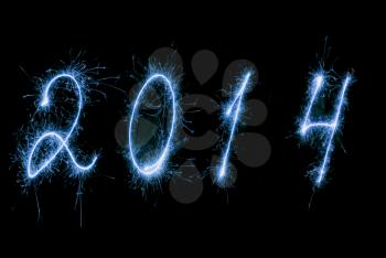 Happy New Year 2014, the inscription made ​​sparklers.