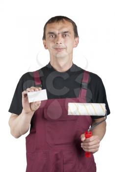Royalty Free Photo of a Painter With a Roller and a Business Card