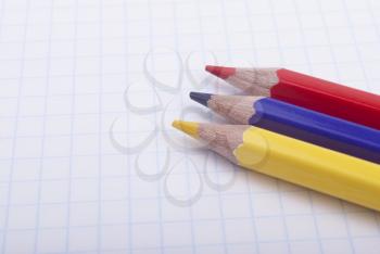 Royalty Free Photo of Coloured Pencils on Paper