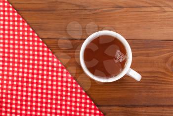 Tea table cloth on a wooden table.